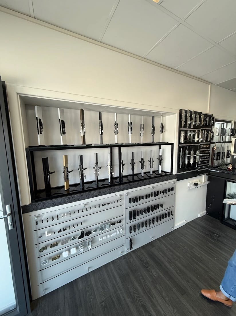 Wall of sliding door locks and handles on display at the Slide Master Hardware showroom in Wangara, Perth